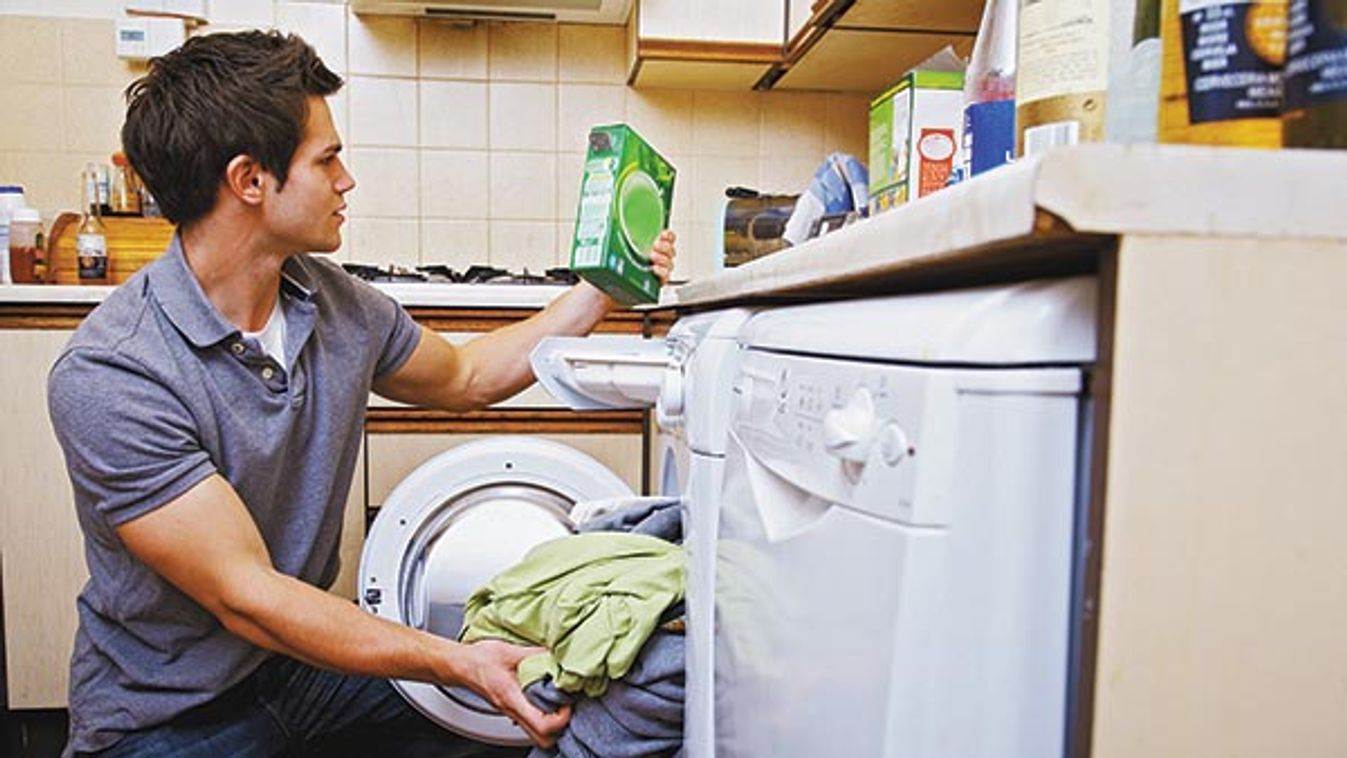 Young man doing the washing