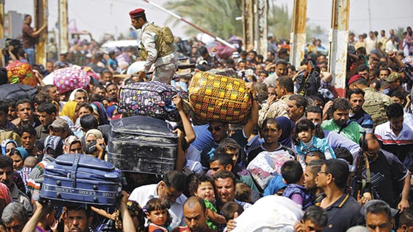 Displaced Sunni people, who fled the violence in the city of Ramadi, arrive at the outskirts of Baghdad