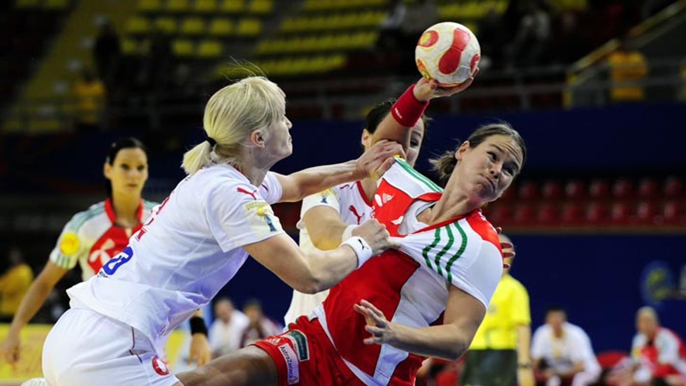 Hungary's Hornyak is challenged by Denmark's Skov during Euro 2008 women's preliminary round handball match in Skopje