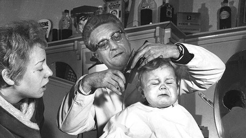 Little boy at the barber's, London