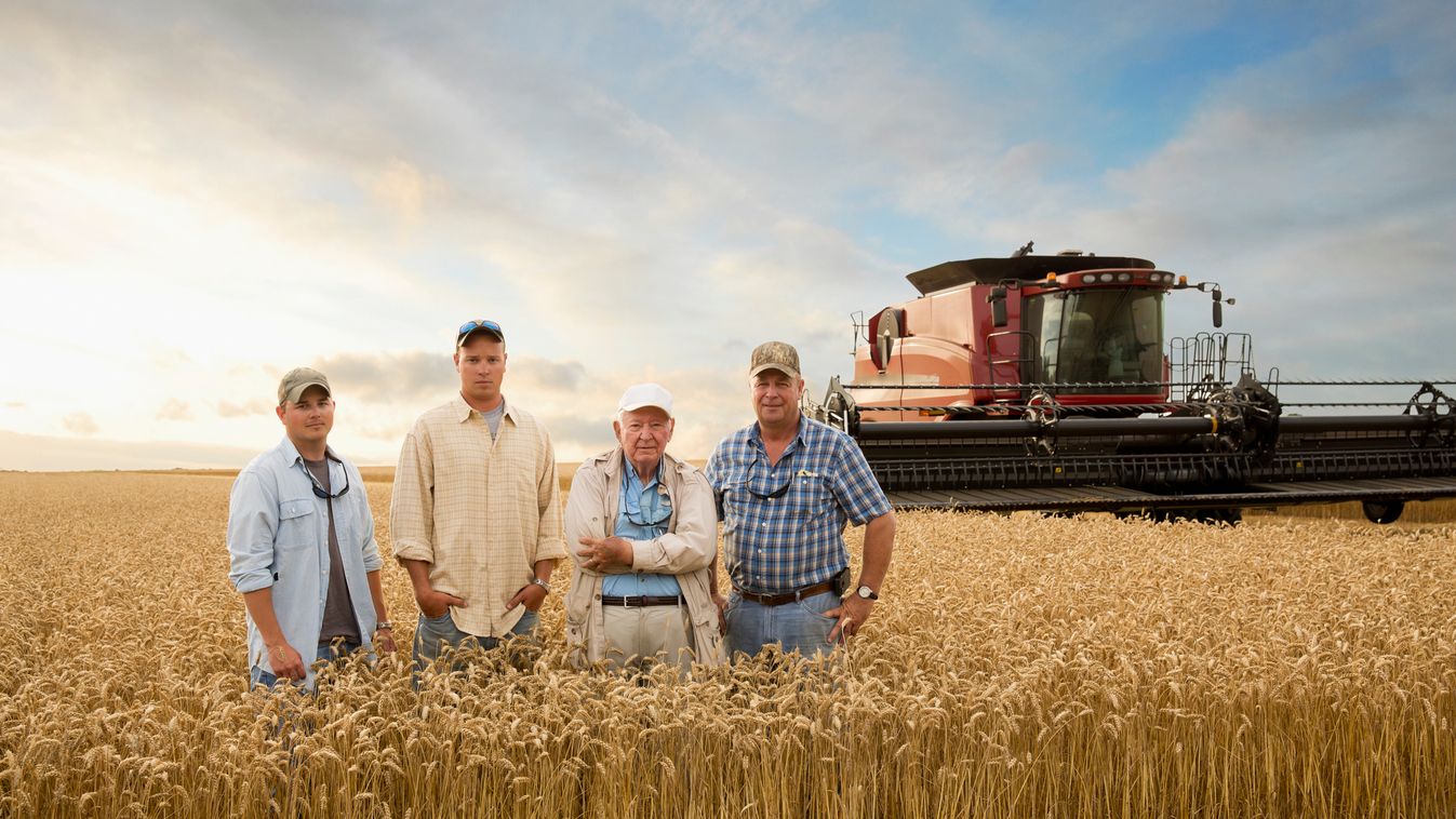 Three generations of Caucasian farmers in wheat field