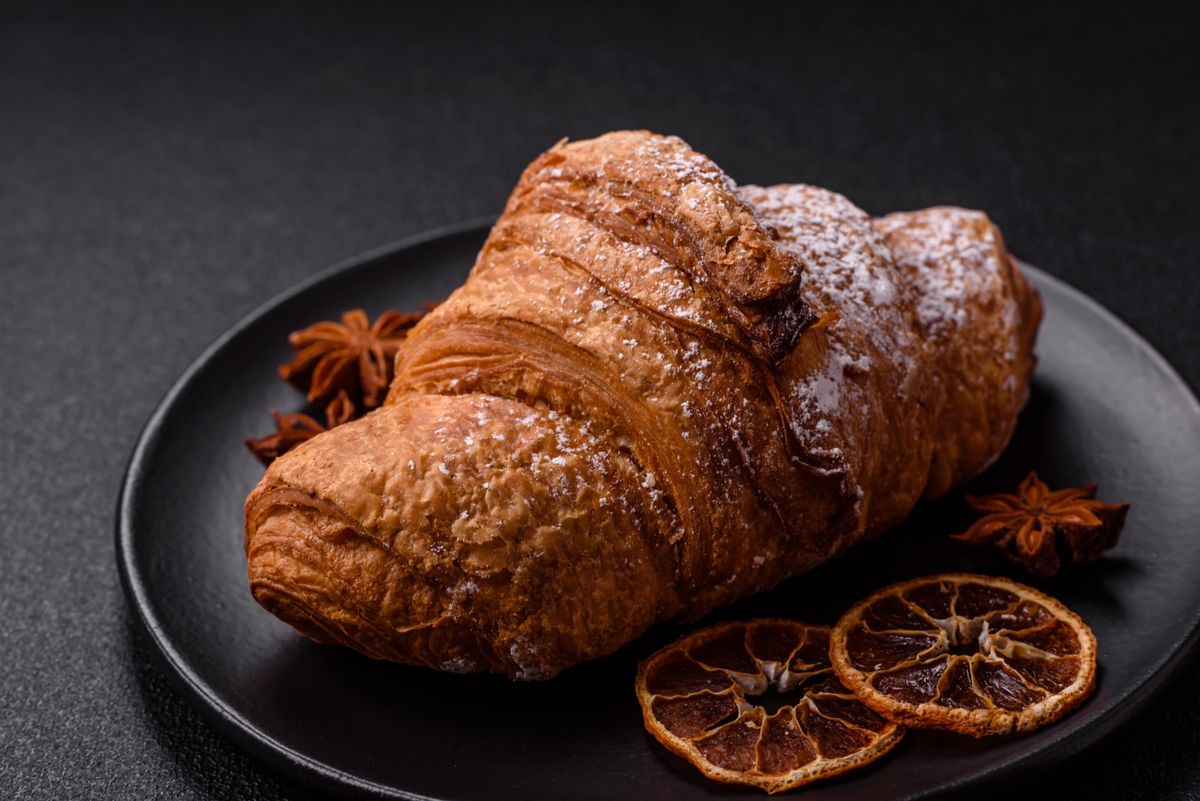 Delicious,Crispy,Sweet,Croissant,With,Chocolate,On,A,Dark,Concrete