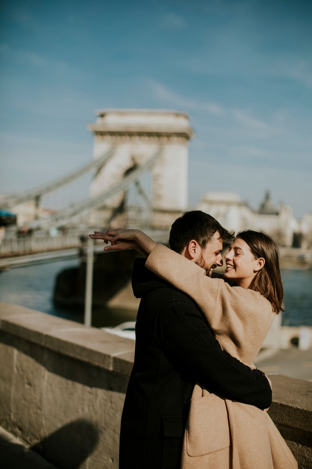 Young,Happy,Attractive,Couple,In,Love,Hugging,At,The,Background