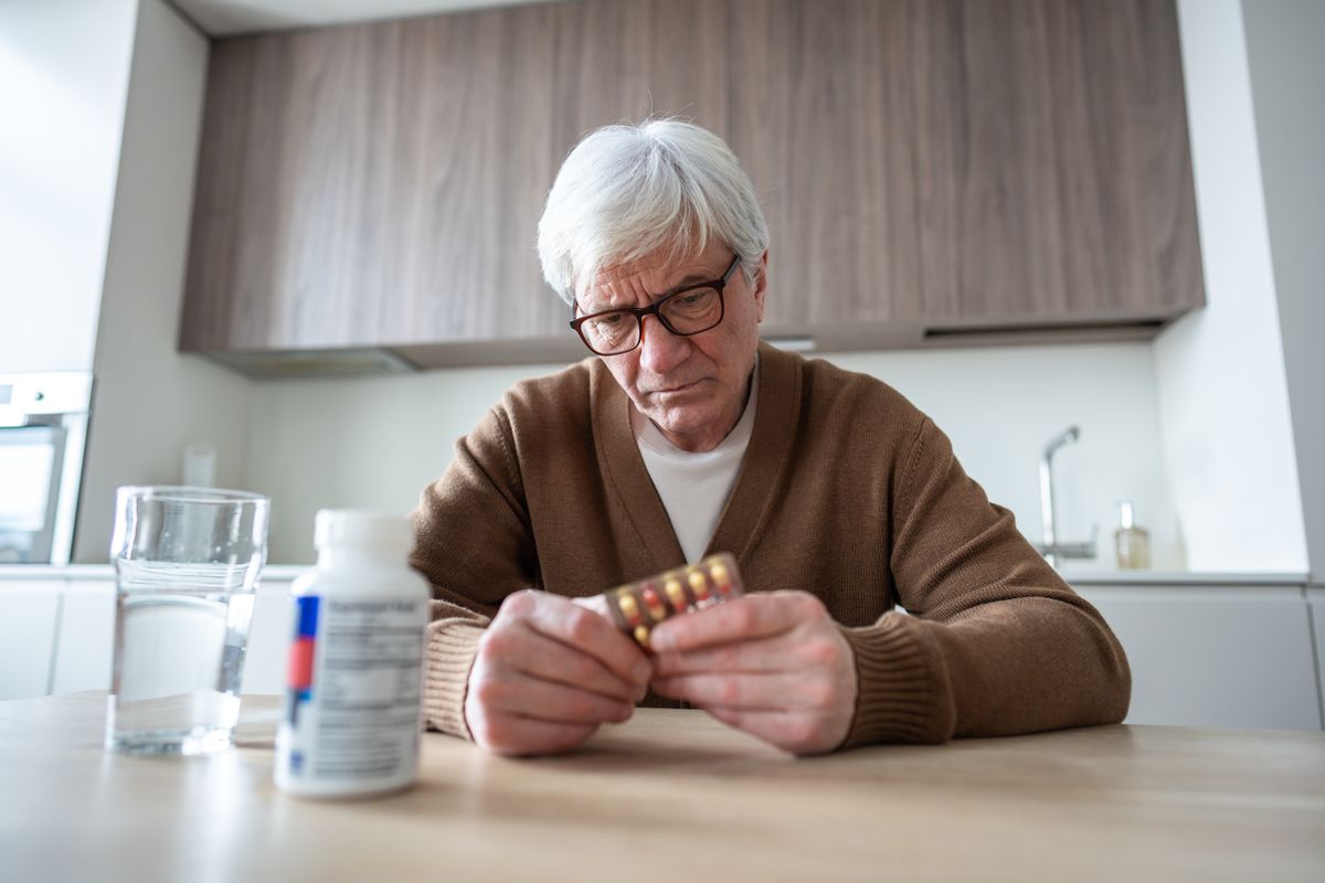 Frustrated,Old,Man,Takes,Daily,Medication,Pile.,Multiple,Chronic,Illness,