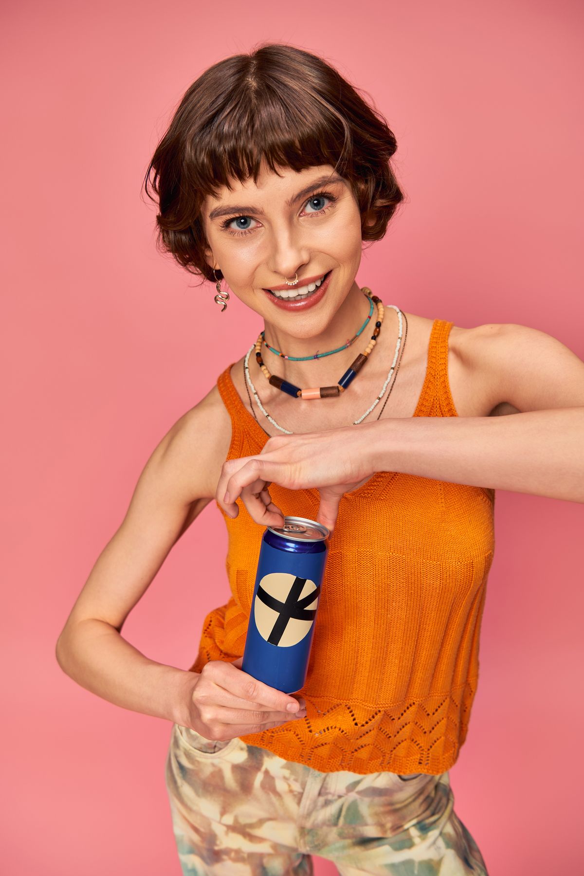 Cheerful,Young,Woman,With,Short,Brunette,Hair,Opening,Refreshing,Soda