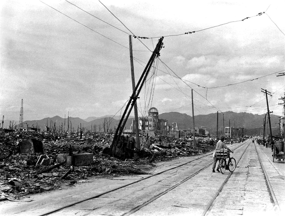 Japan: A Japanese man with a bicycle walks through the ruins of Hiroshima following the dropping of the world's first atomic bomb on the city on 6 August 1945