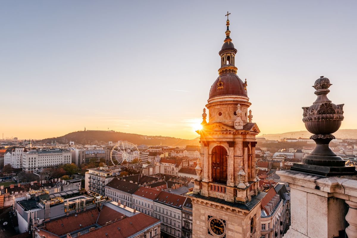 Tower of St. Stephen's Basilica and Budapest skyline at sunset, aerial wide angle view, Hungary
