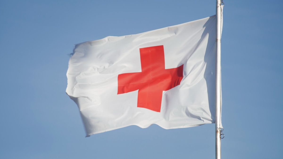 First Aid/Medic Red cross flag and blue sky.