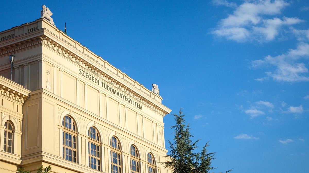 Main Building of Szeged University, on the Dugonics Ter Square, taken during a summer afternoon, with the word "Szeged university" written on the front of it in Hungarian