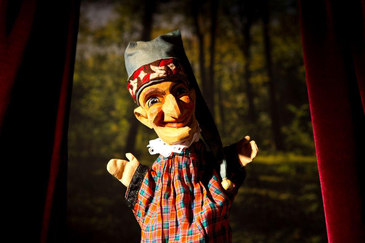 Punch from the classic puppet show Punch and Judy standing on stage